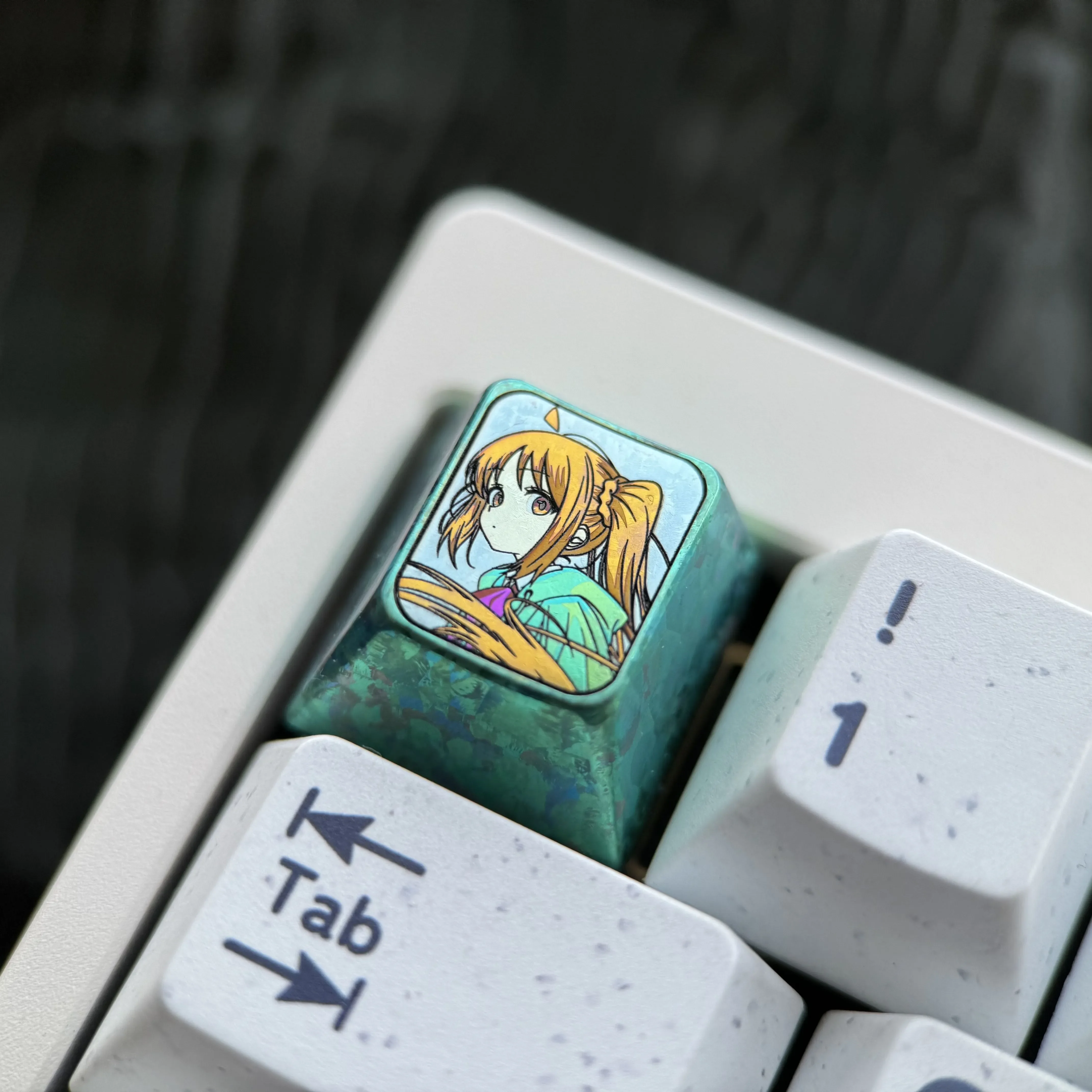 Gallery of the exclusive Bocchi the Rock titanium keycap, displaying its vibrant anime character art and premium ice crystal green finish.
