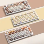 A playful gallery view of the adorable Calico Cat Keycaps Set, showing vibrant, detailed PBT dye-sub designs from multiple angles for custom mechanical keyboard.