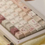 Caramel Keycaps set displayed from multiple angles, highlighting the luxurious texture and cozy winter aesthetic with comforting caramel and