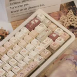 Caramel Keycap Set displayed from multiple angles, showcasing the cozy winter haven aesthetic with comforting caramel and cream tones.