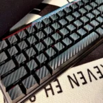 Premium Forged Black Carbon Fiber side-print keycap set gallery. Displays sleek matte finish, unique texture, and crisp legends for mechanical keyboards.