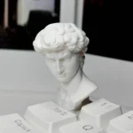 Gallery of the handcrafted classical David sculpture keycap, showcasing its exquisite miniature bust and detailed artistic craftsmanship.