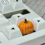 Multiple views of the whimsical handcrafted Dungeon Meshi pumpkin keycap, showcasing its intricate artisan details and playful, unique design.
