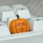 Whimsical handcrafted Dungeon Meshi pumpkin keycap, showcasing its intricate artisan details and playful Halloween design.