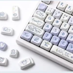 A playful Dog Keycap Set showcasing endearing cartoon dog characters on durable PBT dye-sub MOA profile keycaps from multiple angles.