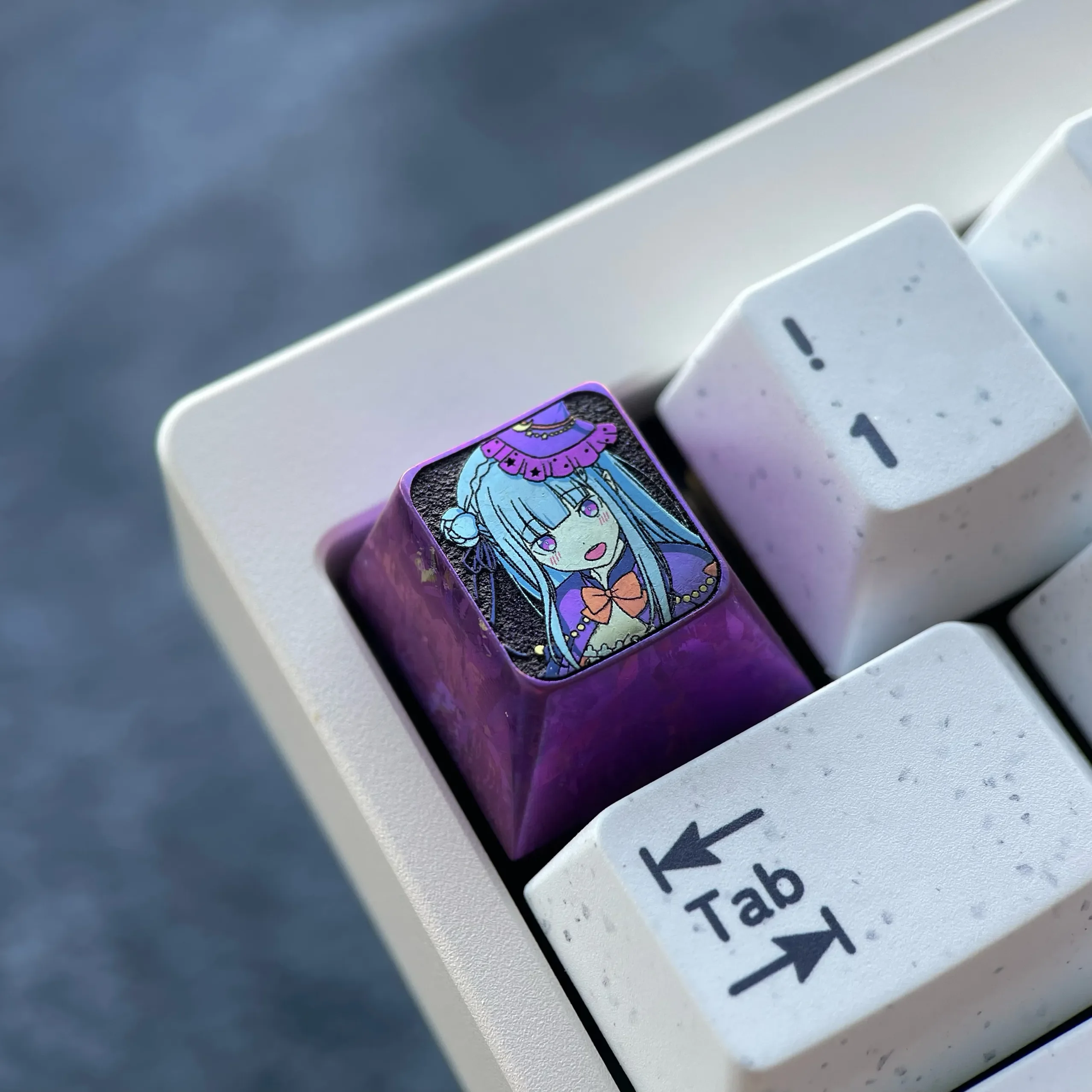 Premium Emilia Titanium Keycap, a premium artisan Halloween custom metal keycap, viewed from various angles showcasing its anime design and anodized design.
