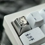 Multiple angles of the hand-sculpted Titanium Frieren keycap, showcasing its precision-carved anime portrait and mirror-finish artisan craftsmanship setup.