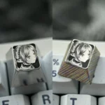 Stunning hand-sculpted Frieren keycap crafted from titanium, showcasing precision anime art and intricate stippling on a mirror finish.