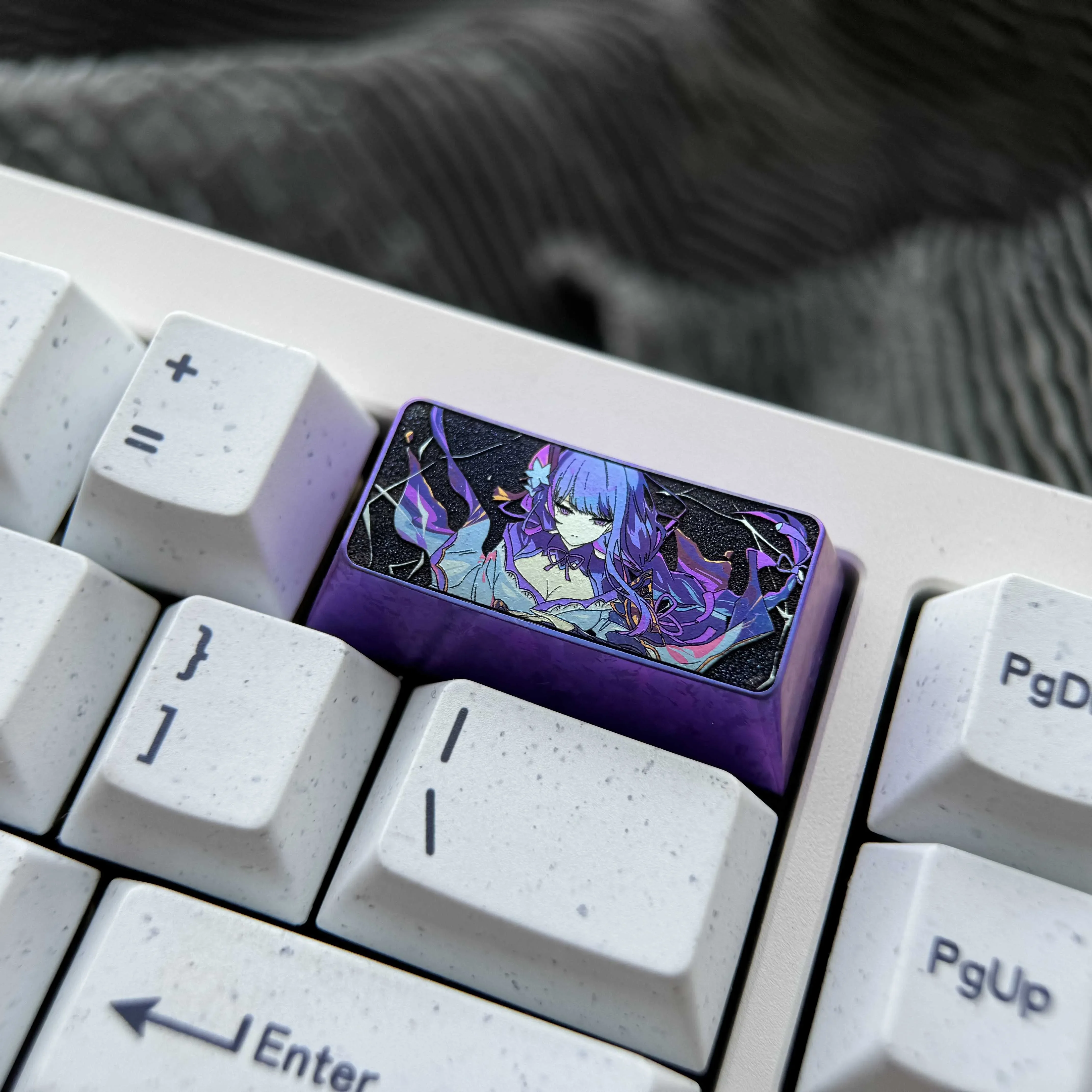 Colorful titanium alloy Raiden Shogun 2U backspace keycap, custom-designed for a unique mechanical keyboard anime aesthetic.