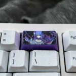 Custom-crafted titanium alloy 2U backspace keycap features the iconic Raiden Shogun from Genshin Impact for unique keyboard personalization.