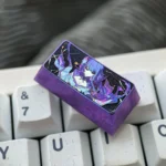 A vibrant Raiden Shogun 2U backspace keycap, crafted from colorful titanium alloy, customizes any mechanical keyboard with anime flair.