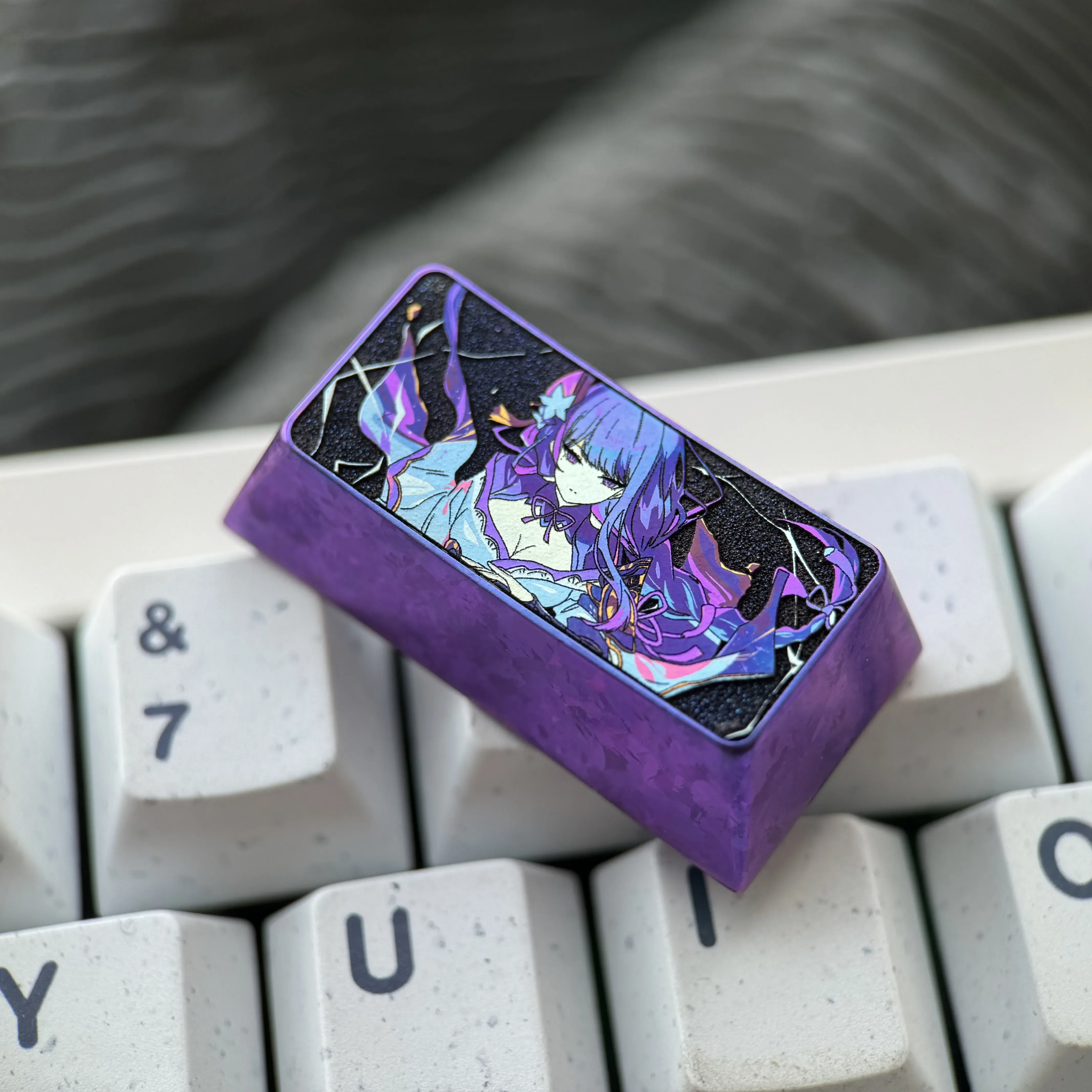 A vibrant Raiden Shogun 2U backspace keycap, crafted from colorful titanium alloy, customizes any mechanical keyboard with anime flair.