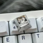 A legendary hand-carved titanium Goku keycap, an artisan anime art piece with striking metallic details for keyboard enthusiasts.