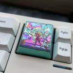 A collection of artistic shots showcasing the iconic Hatsune Miku titanium alloy keycap, highlighting its vibrant art and iridescent futuristic design.