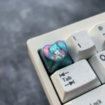 Official Hatsune Miku Titanium Artisan Keycap gallery shows vibrant heart design, polished colorful metal from various angles.