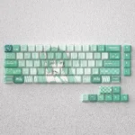 Vibrant Hatsune Miku PBT keycap set for 60% keyboards, featuring iconic turquoise anime character art in Cherry profile.