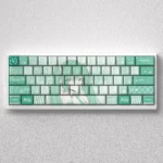 Vibrant Hatsune Miku PBT Keycaps set for 60% keyboards, showcasing iconic anime art in playful turquoise.