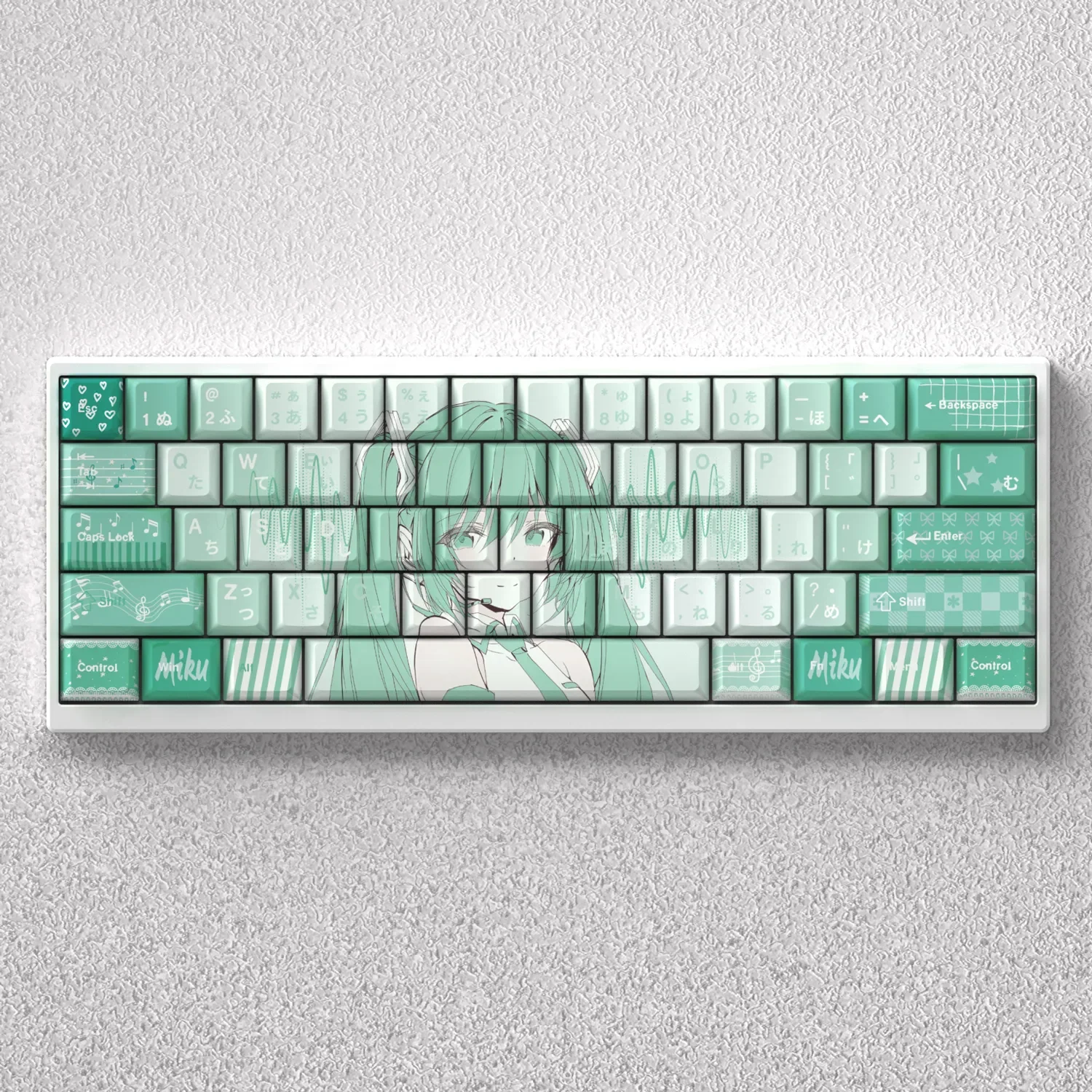 Vibrant Hatsune Miku PBT Keycaps set for 60% keyboards, showcasing iconic anime art in playful turquoise.