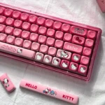Charming Hello Kitty mechanical keyboard with a playful pastel design, highlighting its wireless tri-mode and hot-swappable features for DIY fun.