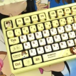 Hirasawa Yui K-On! RGB translucent pudding keycaps set displayed from multiple angles, highlighting the iconic anime design and vibrant four-sided transmit light.