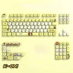 Gallery of vibrant K-On! Hirasawa Yui pudding keycaps set showcasing four-sided RGB translucency on a mechanical keyboard setup.