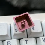 Showcasing multiple angles of the exclusive Ichinose Honami titanium keycap with vibrant anime art and lustrous metallic finish for mechanical keyboard.