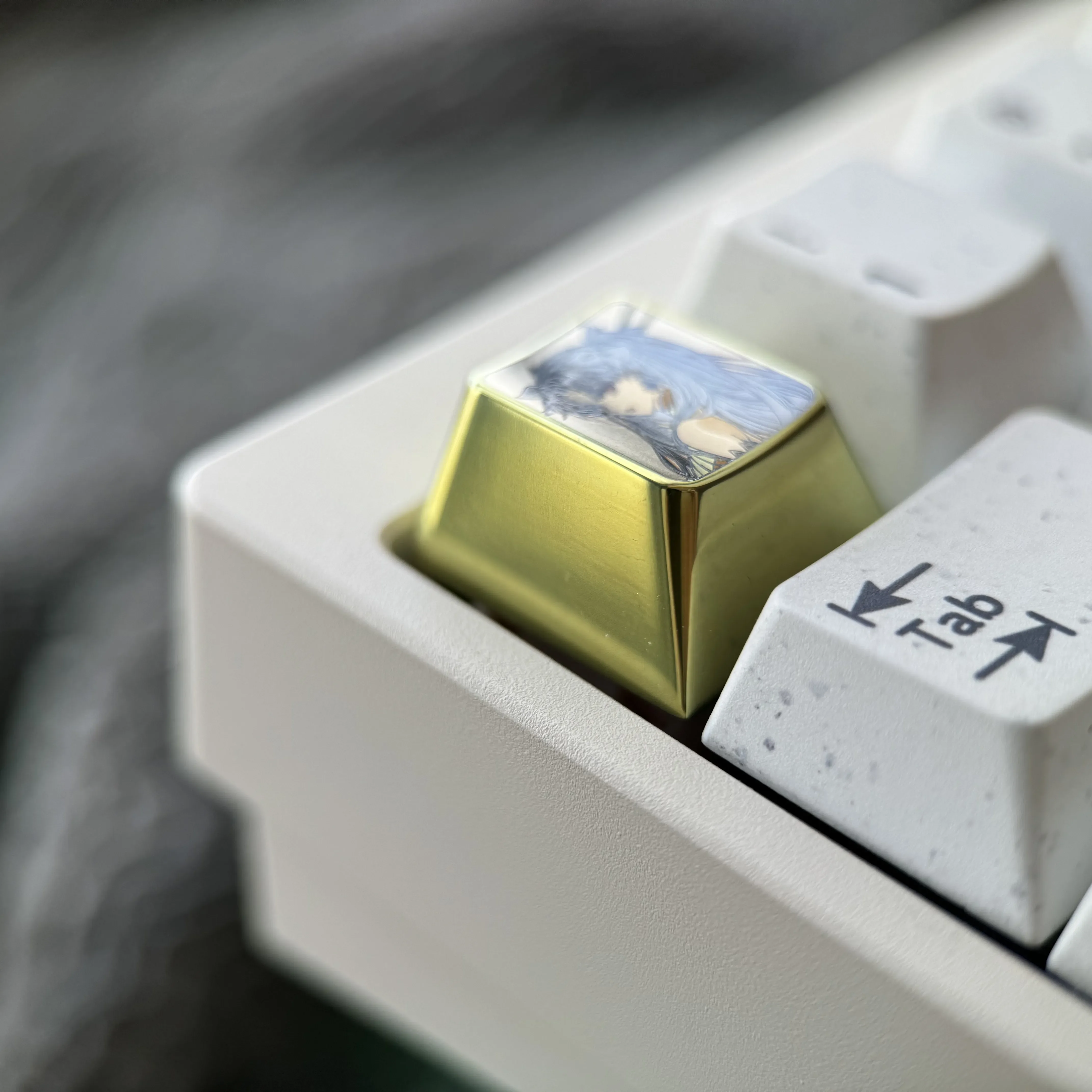Gallery of vibrant titanium Ishtar artisan keycap images, showcasing its celestial anime goddess design, intricate details, and premium metallic.