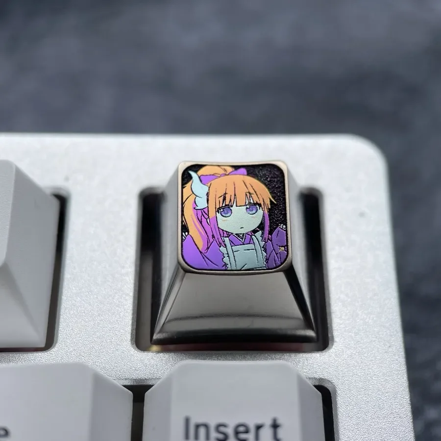Collectible vibrant titanium Kanna Kamui ESC keycap, brilliantly showcasing playful Dragon Maid anime art with a metallic purple gleam.