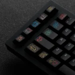 Dynamic gallery shot of iconic Keith Haring PBT keycaps set, revealing multiple angles of the bold graffiti art designs and premium PBT durability.