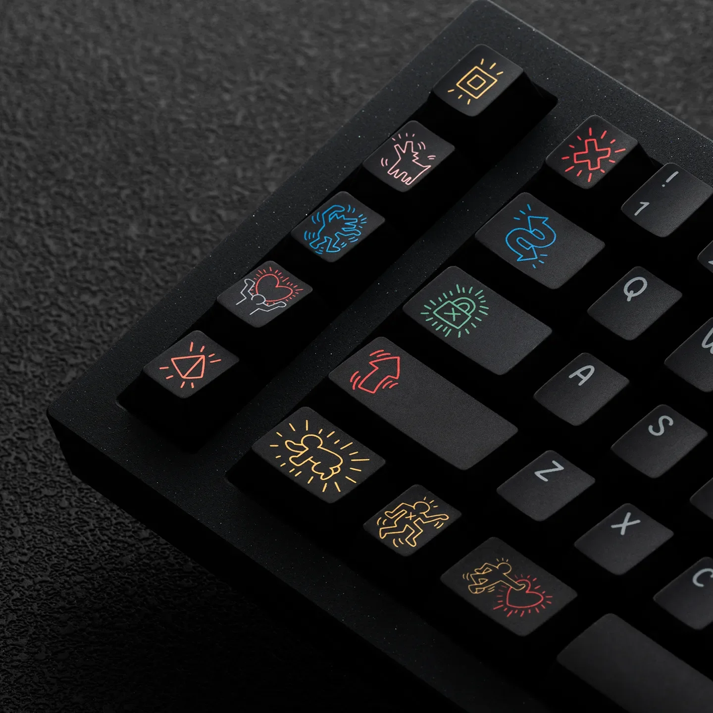 Dynamic gallery shot of iconic Keith Haring PBT keycaps set, revealing multiple angles of the bold graffiti art designs and premium PBT durability.