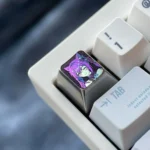 Keqing Titanium Artisan Keycap featuring a luminous ice crystal purple anodized finish, highlighting its premium craftsmanship and electro-inspired.