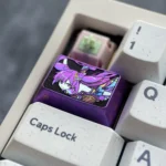 Exclusive Keqing titanium alloy keycap showcased from multiple angles, highlighting its sleek metallic purple finish and intricate Genshin Impact.