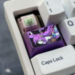 Premium Keqing titanium alloy keycap featuring sleek metallic purple and refined Genshin Impact aesthetic. A unique custom metal keycap.