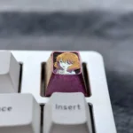 Premium Kumiko Oumae titanium anime ESC keycap. Vibrant art, polished finish, and icy accents showcased. An artistic mechanical keyboard essential.