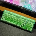 Multi-angle view of the vibrant lime green 98-key tri-mode mechanical keyboard, highlighting hot-swappable switches and versatile connections.