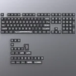 This Luminous Black Cherry Keycap Set in sleek black reveals mesmerizing cat's eye backlit legends, offering a unique keyboard aesthetic.