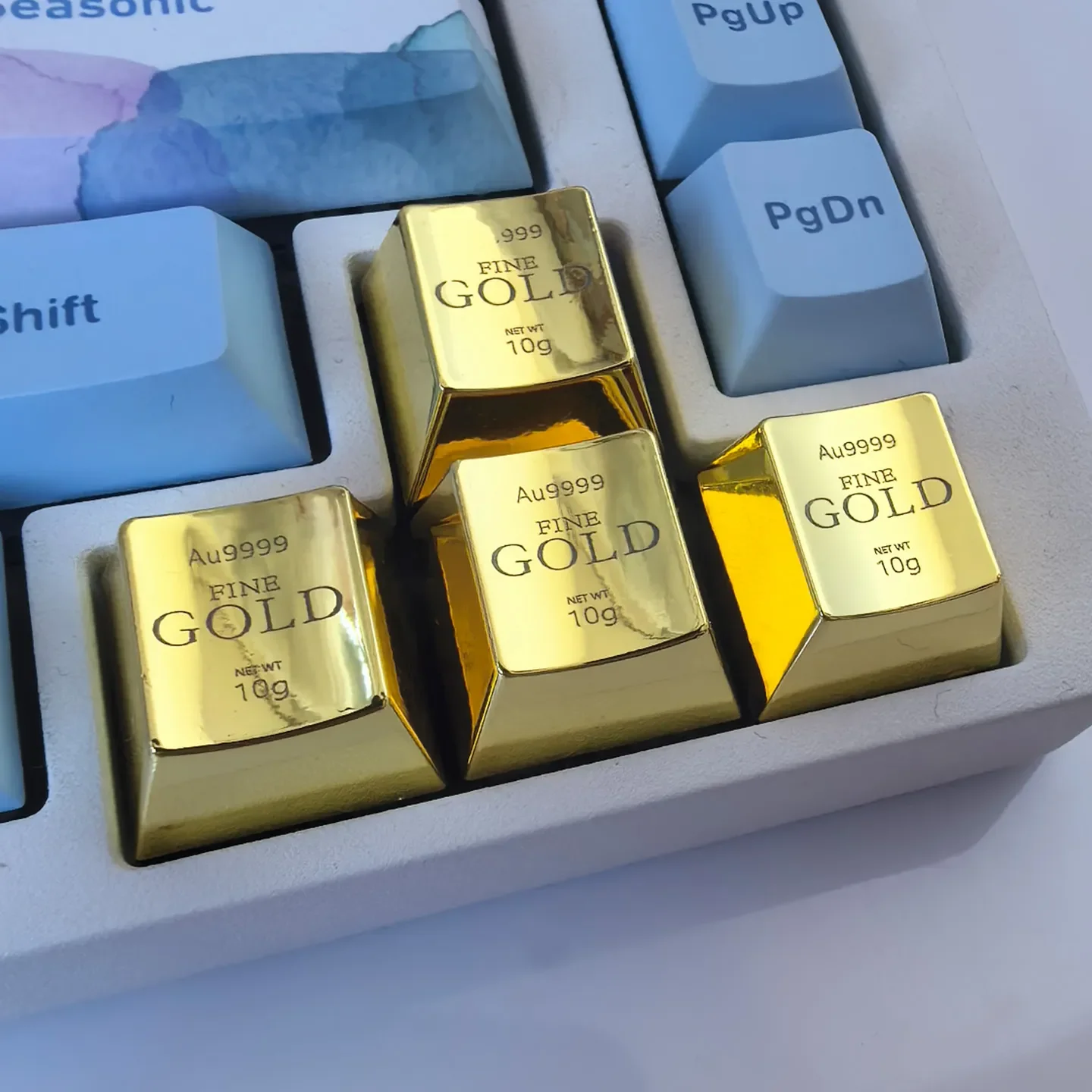 Multiple views of the luxury gold ESC keycap, showcasing its intricate laser engraving and heavy feel for a premium keyboard upgrade.