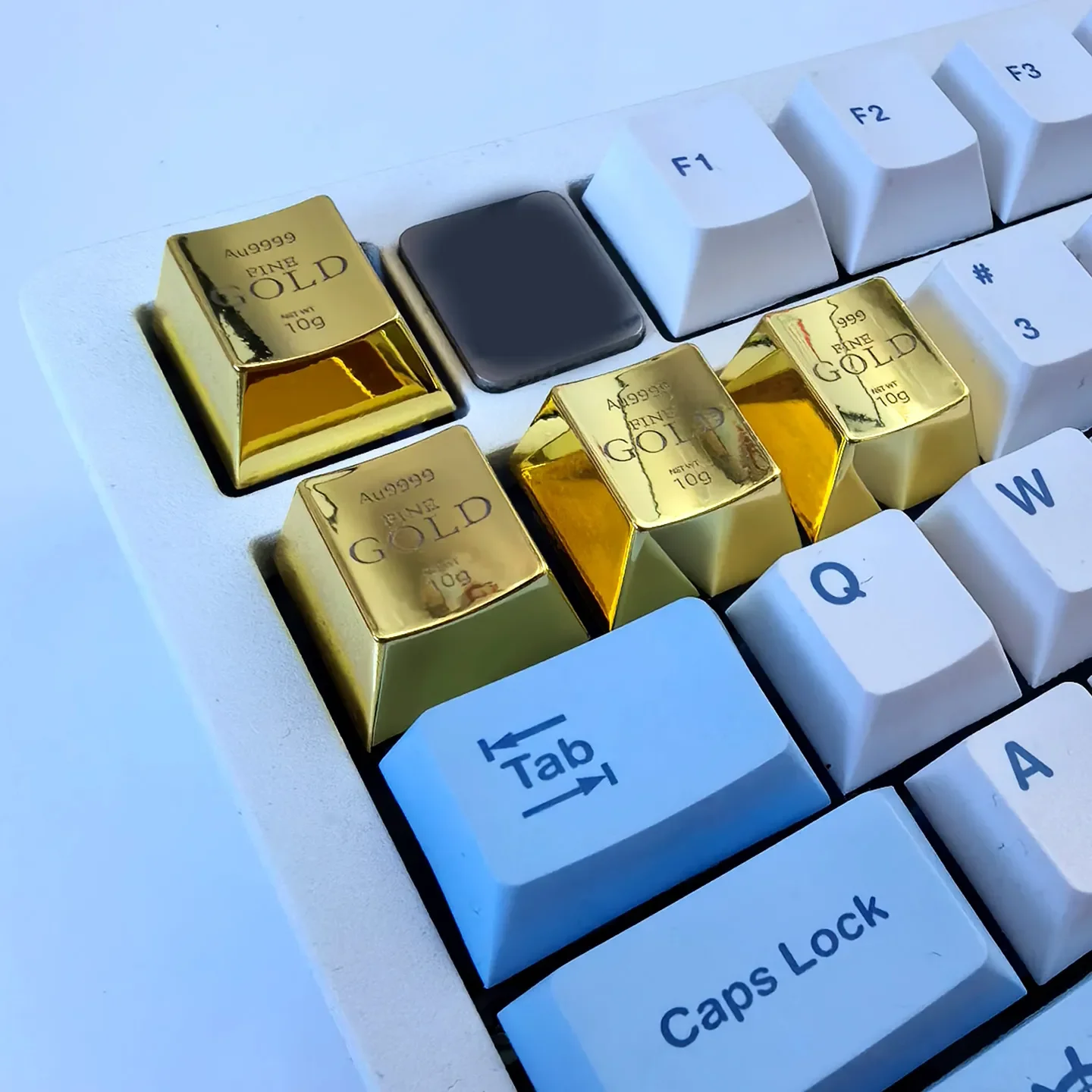 Luxury laser engraved gold ESC keycap showcased from multiple angles, highlighting its heavy feel and intricate design as a premium keyboard.