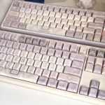An artistic gallery of Magic Poetry Dreamscape Side-Printed Backlit Magic Keycap set, highlighting their ethereal light purple glow and mystical