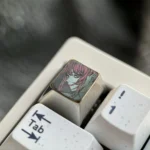 Exquisite hand-carved Makima titanium keycap, a premium Chainsaw Man homage, showcases elegant Makima line art on sleek, colored titanium.