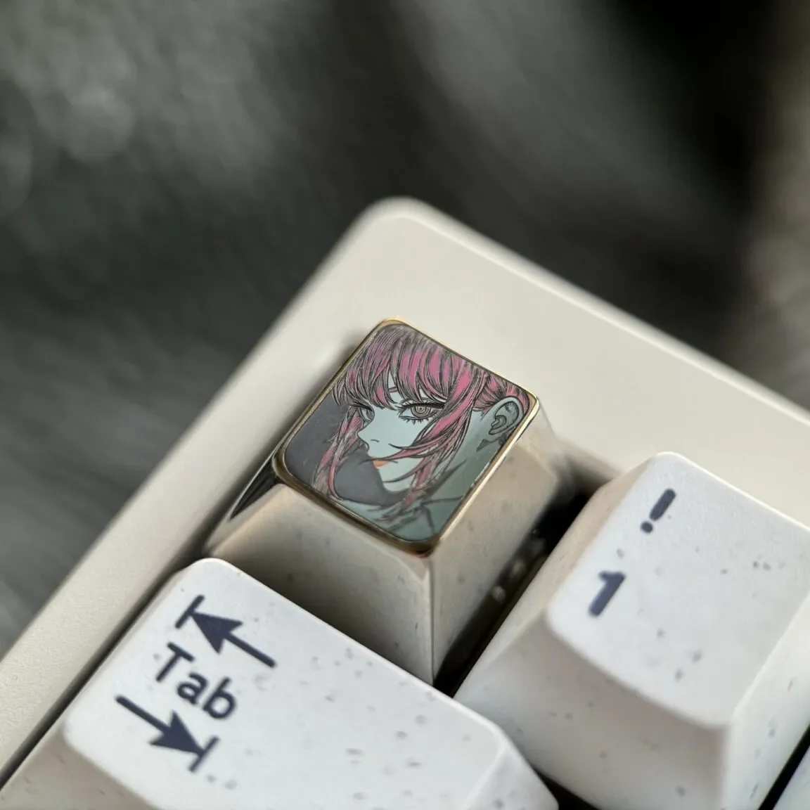 Exquisite hand-carved Makima titanium keycap, a premium Chainsaw Man homage, showcases elegant Makima line art on sleek, colored titanium.