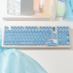 Mesmerizing Gemstone Blue Keycaps set in a product gallery, revealing their iridescent depth and captivating light from various angles.