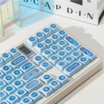 Mesmerizing Gemstone Blue Keycap set gallery, revealing their iridescent blue and deep cat's eye effect from multiple angles.