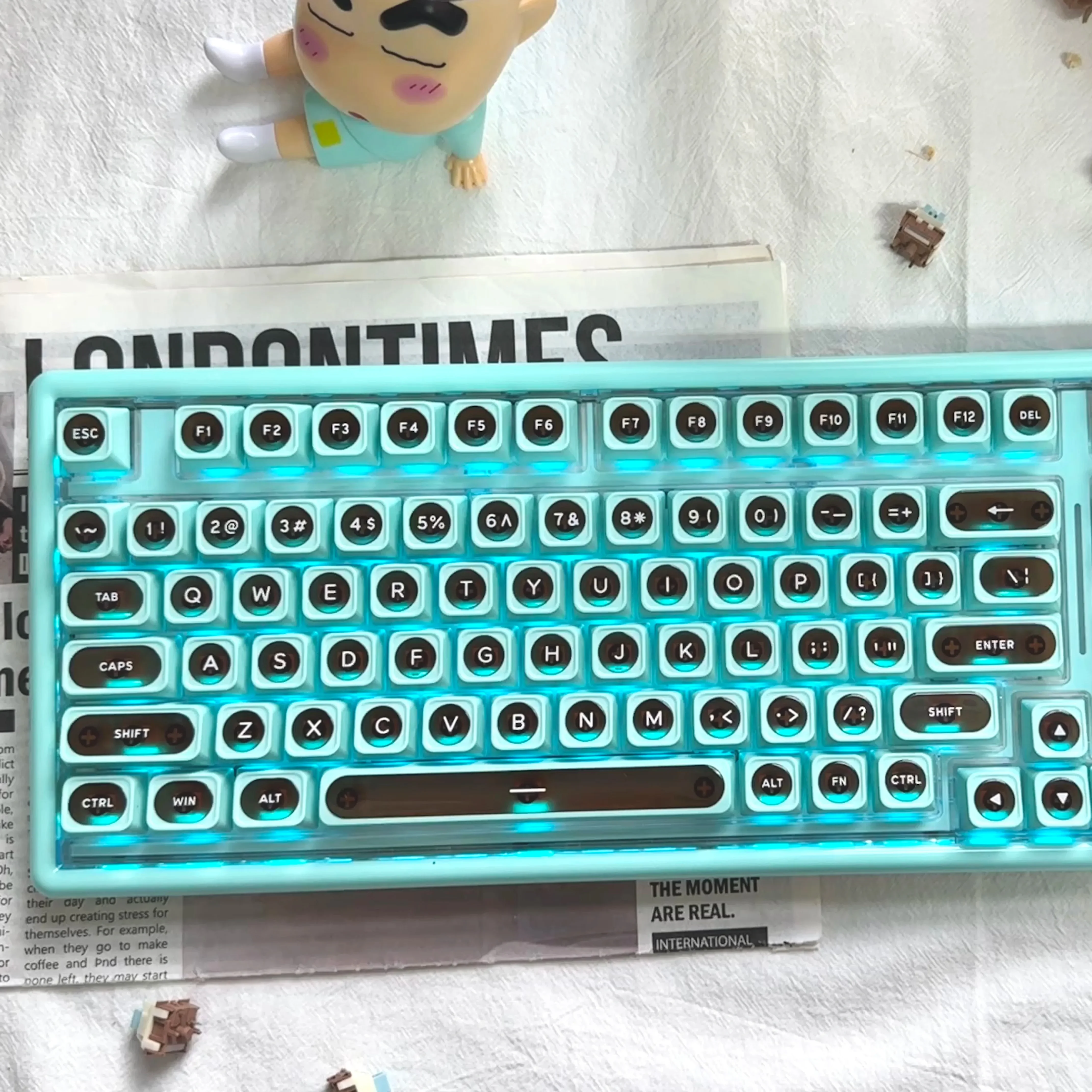 Ainbell Base99 mint chocolate tri-mode hot-swappable mechanical keyboard from multiple angles, highlighting its elegant design and premium features.