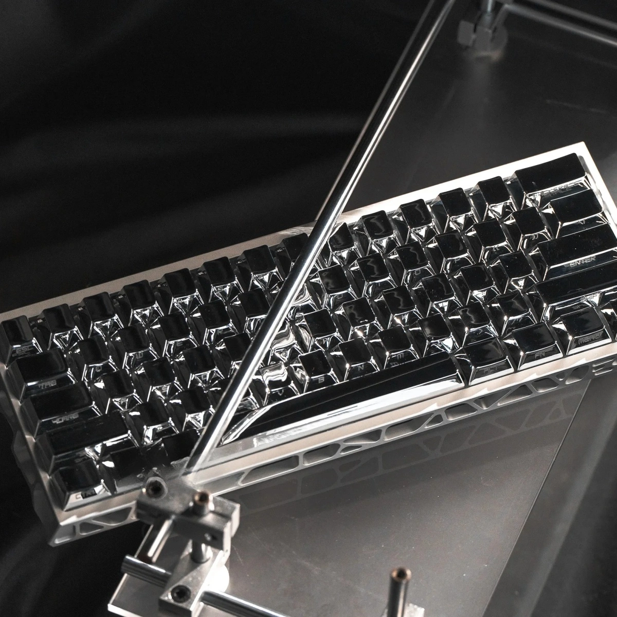 Sleek, Mirror Themed Cherry Keycap Set reflecting light, showcasing their luxurious finish and hinting at a surprisingly lightweight, warm design.