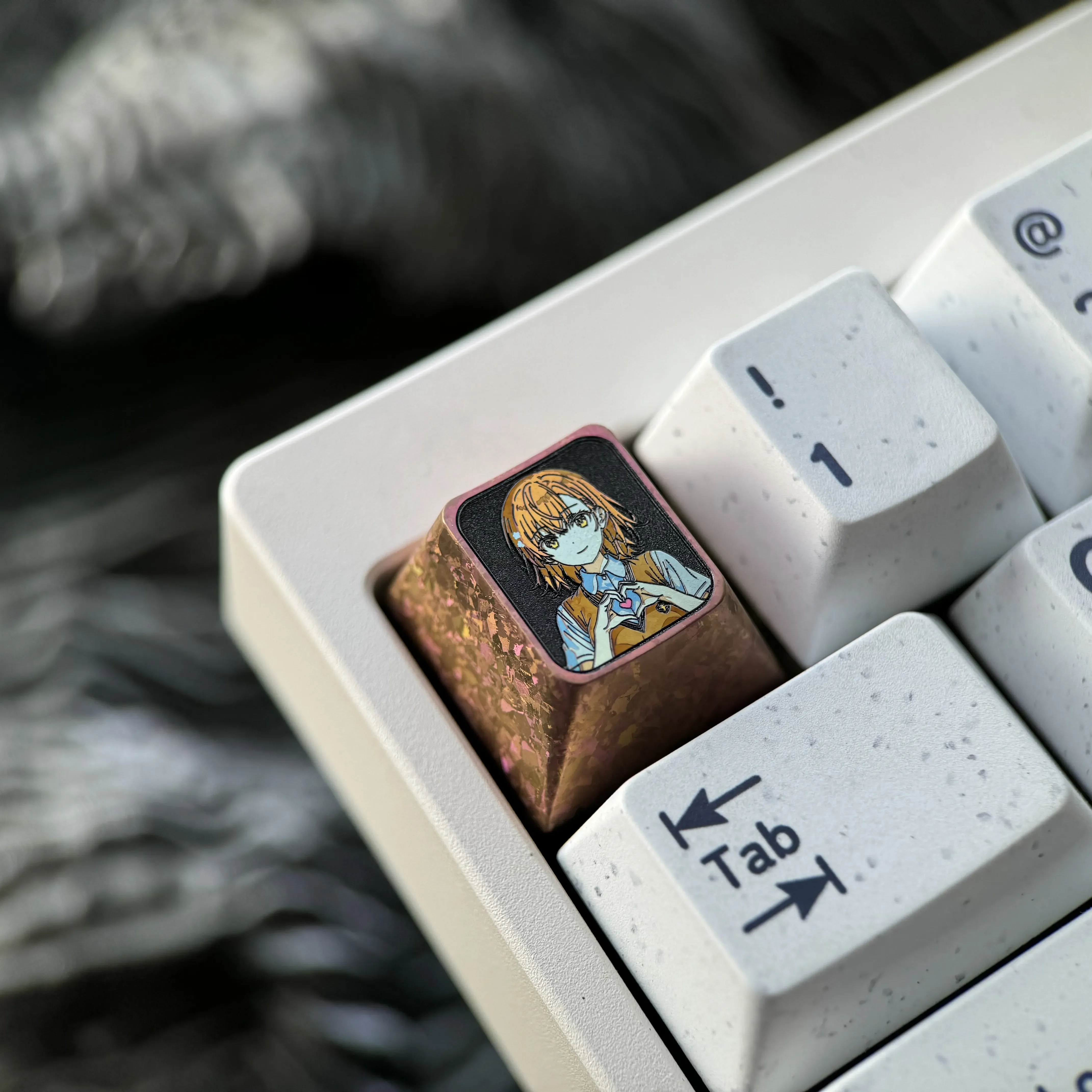 Dynamic views of the premium Titanium Misaka Mikoto keycap, showcasing its vibrant anime character art and exquisite metallic craftsmanship.