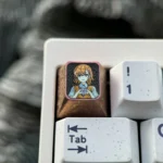 Premium Titanium Misaka Mikoto keycap for mechanical keyboards, prominently displaying vibrant iconic anime character art on its gleaming metallic design.