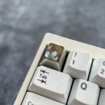 Gallery of the premium chocolate-colored Sengoku Nadeko art keycap, showcasing its unique OEM profile and intricate design from multiple choices.