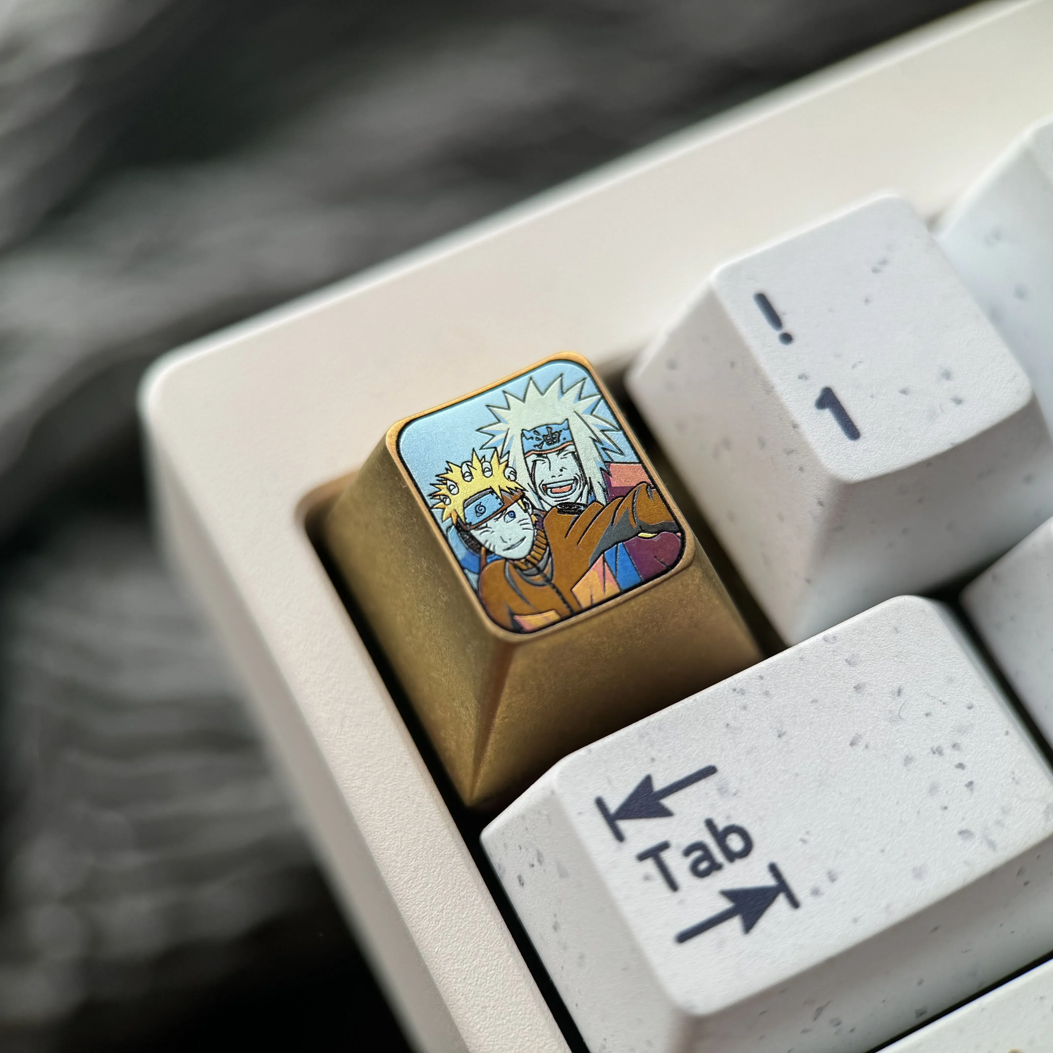 A collection of images displaying the legendary Naruto & Jiraiya titanium art keycaps detailed sculpture and lustrous finish from all sides.