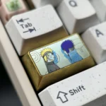 Collection of Premium Naruto and Sasuke Titanium Artisan Keycaps, displayed from multiple angles, highlighting vibrant anime character art.
